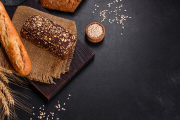 Fresh Bread on black background, top view, copy space