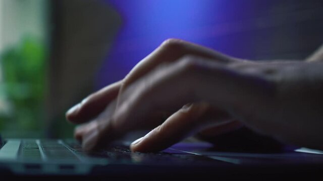 Businessman working late night. Keyboard typing by close up shot fingers in dark room. High quality 4k footage