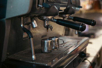 Fototapeta na wymiar Close up of the process of making espresso in a professional coffee machine.