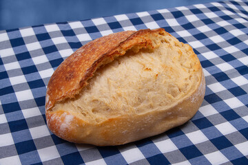 White bread with golden brown crust on blue background