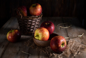 Red apples on a rustic wooden table