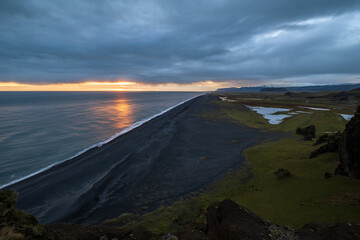 Picturesque autumn evening view to endless ocean  black volcanic sand beach from Dyrholaey Cape Viewpoint, Vik, South Iceland.