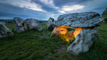 Tombstones in the sunset on a meadow