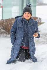 Fototapeta premium Woman Walking in Deep Snow