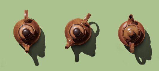 Old vintage tea pot on green pastel background