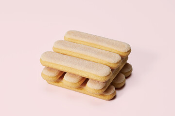 Italian savoiardi ladyfinger on pink pastel background