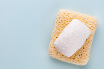 Soap bar and foam on white background, top view. Mockup for design