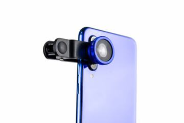 Phone photo lens with clips on white background. Extra macro camera for smartphone. Set of lenses wide angle, fish eye and macro
