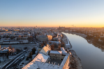 Krakow city center aerial view in Snowy winter. Sunset over Wawel castle from Nortbertine convent