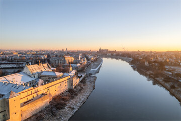 Krakow city center aerial view in Snowy winter. Sunset over Wawel castle from Nortbertine convent