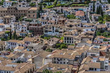 Obraz premium Beautiful aerial view city of Granada in a daytime. Granada - capital city of province of Granada, located at foot of Sierra Nevada Mountains. Granada, Andalusia, Spain.