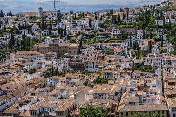 Obraz premium Beautiful aerial view city of Granada in a daytime. Granada - capital city of province of Granada, located at foot of Sierra Nevada Mountains. Granada, Andalusia, Spain.