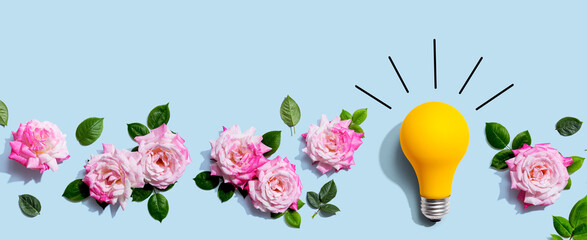 Light bulb with pink roses - flat lay