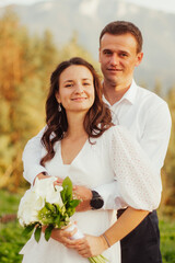 Couple in the park on their wedding day,