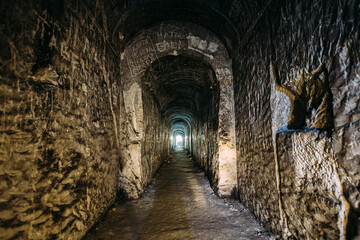 Fototapeta na wymiar Dark creepy abandoned underground chalky cave temple