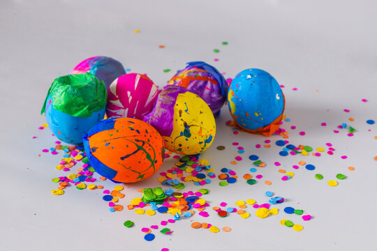 Painted eggshells in a colorful way and filled with confetti for carnaval, a latinamerican tradition specially in Guatemala. Placed on a white background. 