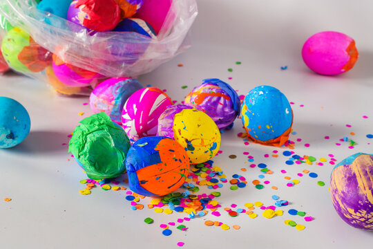 Painted eggshells in a colorful way and filled with confetti for carnaval, a latinamerican tradition specially in Guatemala. Placed on a white background. 