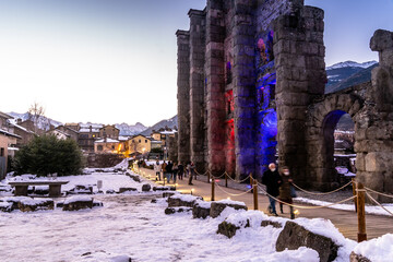 Aosta, roman teatre with snow at sunset. Remains of the Roman theater, built in 25 BC. covered with snow during the Christmas holidays