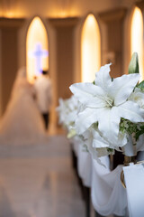 The bride and groom are standing during the wedding