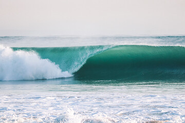 Perfect wave breaking in a beach. Perfect barrel in a surf spot