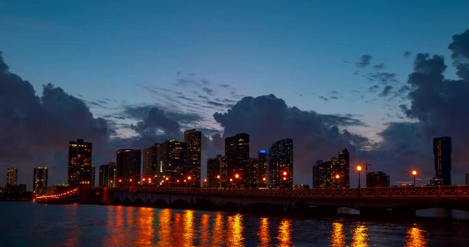 Miami panorama time lapse. Night sky timelapse on Miami beach city. Time-lapse of skyscraper buildings. MacArthur downtown, Causeway city.