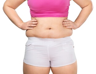 Overweight lady standing with stomach exposed