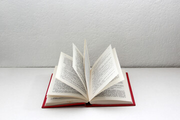 Reading time with an open book ready to be read in the solitude of a room with glasses and coffee to show tranquility and relaxation
