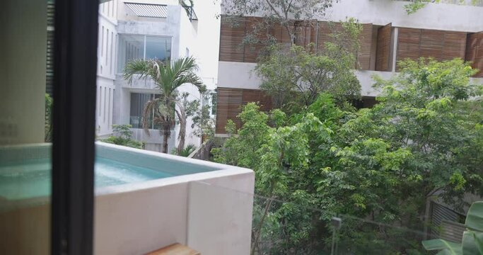Smooth view of hot tub and balcony outside hotel suite