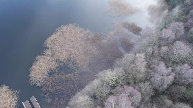 Incredible View, Top-Down of Beautiful Skanderborg Lake in Jutland, Denmark - Dolly In Shot and Tilt Up Shot