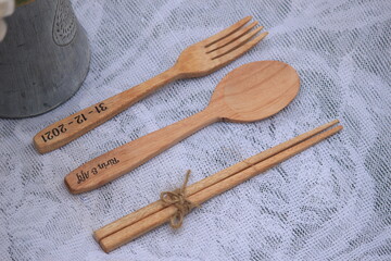 souvenir spoons, forks, and chopsticks made of wood for wedding gifts, gifts. can also be used for eating utensils.