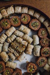 assorted circular tin of middle eastern baklava filo dough pastry sweets