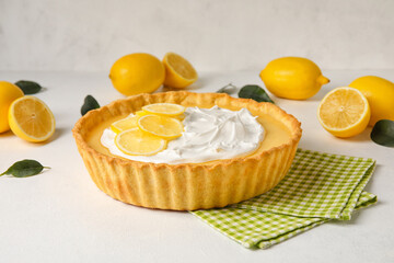 Delicious lemon tart on light background