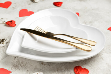 Beautiful table setting for Valentine's Day on light background, closeup