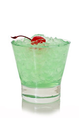 Green alcoholic shot glass with absent, ice and cherry
