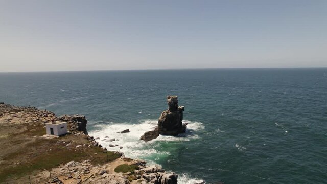 Nau dos Corvos or Ship of Crows, Carvoeiro cape, Peniche in Portugal. Aerial circling
