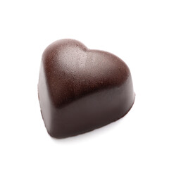 Tasty heart-shaped candy on white background