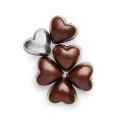 Tasty heart-shaped candies on white background