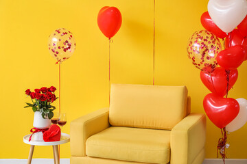 Armchair with beautiful balloons and gift with rose flowers for Valentine's Day in room