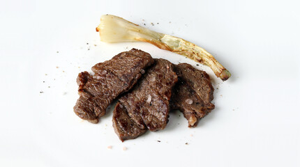 Grilled beef and grilled green onions. Meat and vegetables.
