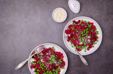 Beetroot pasta with green peas