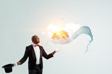 Male illusionist performing tricks . Mixed media