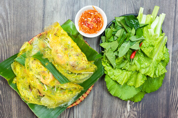 Banh Xeo is a traditional Vietnamese cake.  Cake ingredients include flour, shrimp, pork, twisted...
