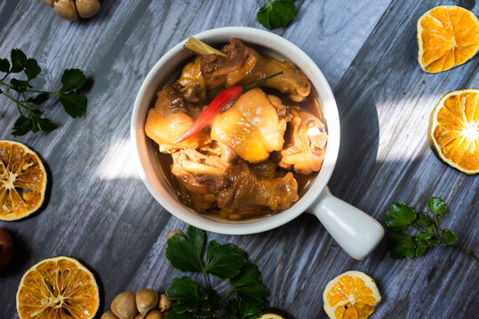 Braised chicken with fish sauce.  ingredients including chicken, fish sauce and seasoning ingredients are added