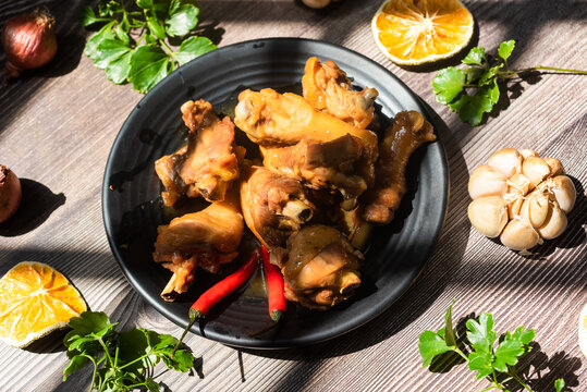 Braised chicken with fish sauce.  ingredients including chicken, fish sauce and seasoning ingredients are added