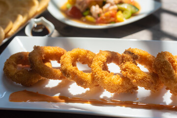 Crispy fried squid rolls.  Ingredients include fresh squid and ruffles and spices