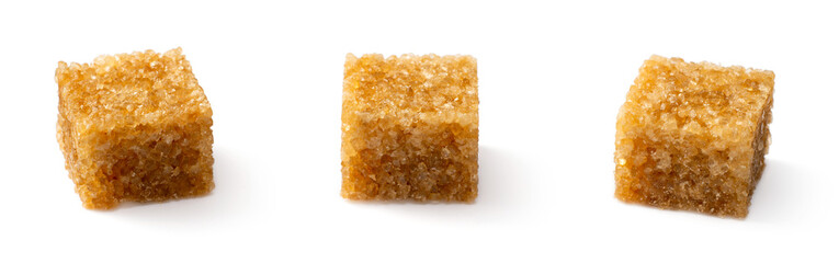 Brown sugar cubes isolated on white background