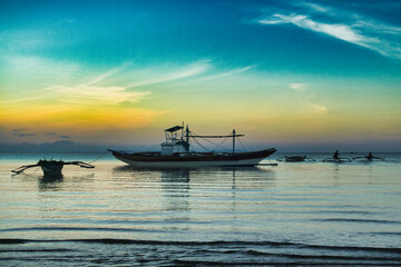 Traditional fishing boat at sunrise. Bulalacao,  Oriental Mindoro. 