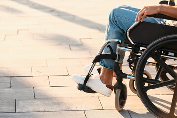 Young man with physical disability outdoors
