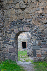 Fototapeta na wymiar the passage in the fortress in the form of an arch was made a long time ago