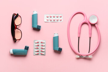 Eyeglasses, stethoscope, pills and asthma inhalers on color background